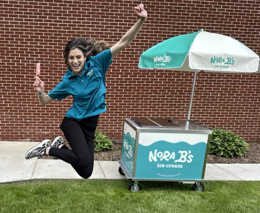 Girl jumping in excitment for nora b's ice cream