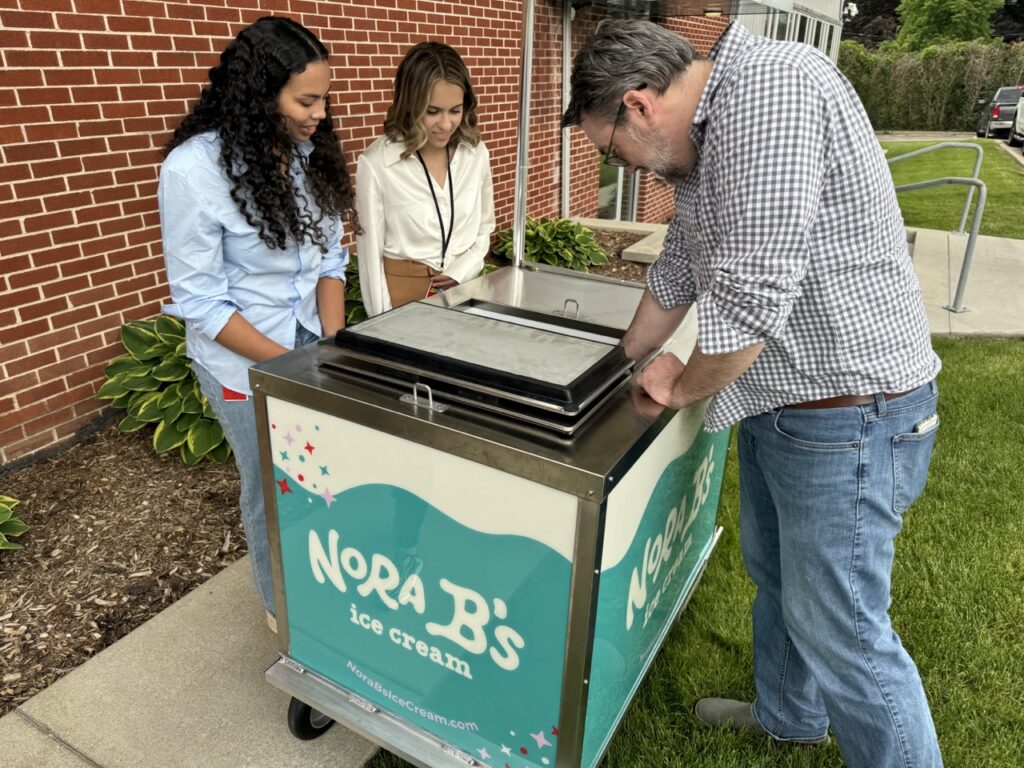 people choosing ice cream out of ice cream cart rental florida